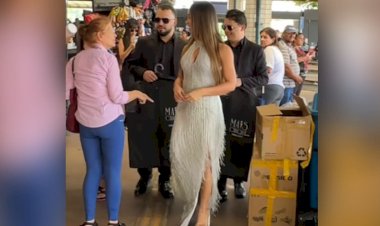 Mulher em traje de gala e com seguranças chama atenção em terminal de Goiânia: ‘famosa, né?’